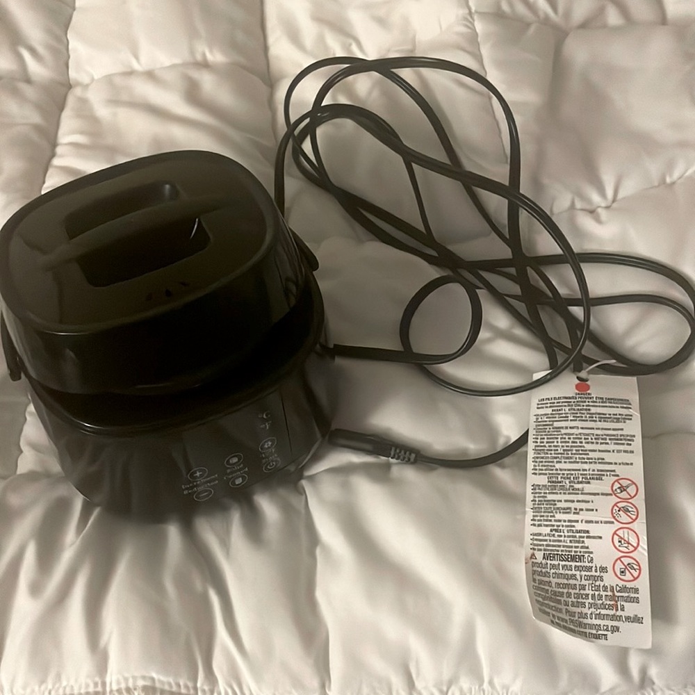 Wax warmer band new only used to test wax is in it never used wax just warmed